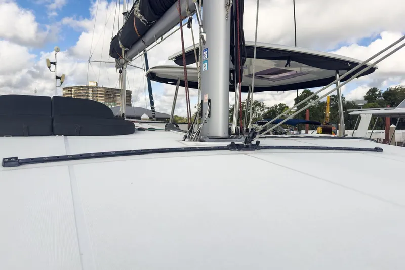 Sweet Sweet Life Yacht Photos Pics 2020 Lagoon 42 catamaran deck with mast and rigging under cloudy sky.