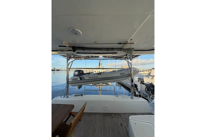 Sweet Sweet Life Yacht Photos Pics 2020 Lagoon 42 yacht with a Highfield dinghy on davits at a marina.