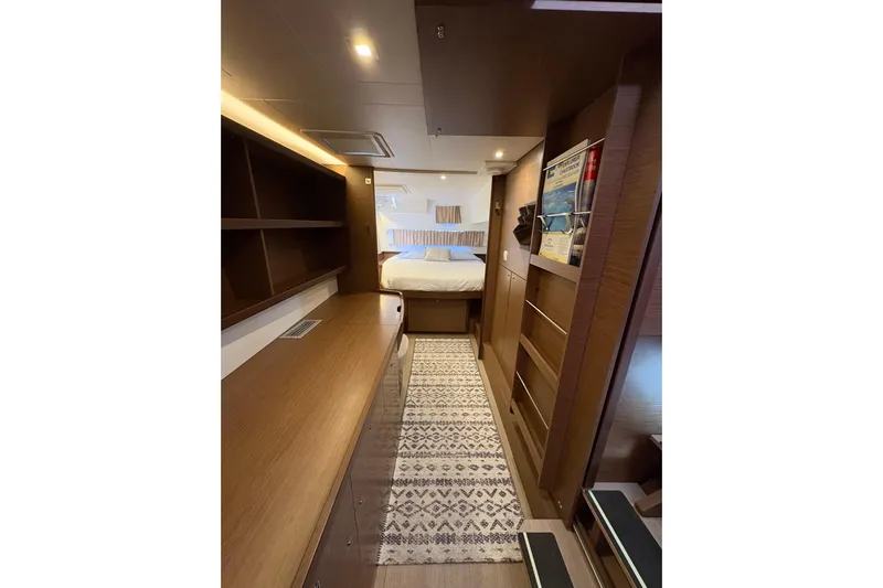 Sweet Sweet Life Yacht Photos Pics Interior of 2020 Lagoon 42 yacht cabin with modern wood finish and cozy bed.