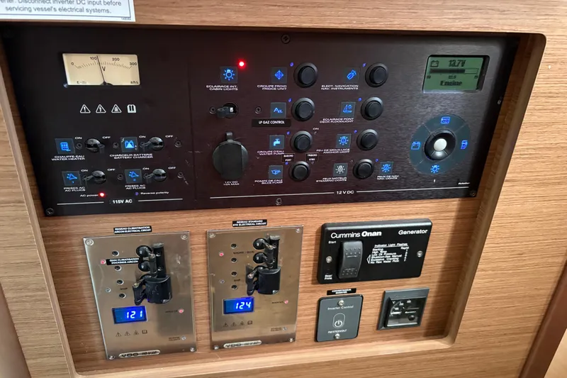 Sweet Sweet Life Yacht Photos Pics Electrical control panel of a 2020 Lagoon 42 catamaran with various switches and displays.