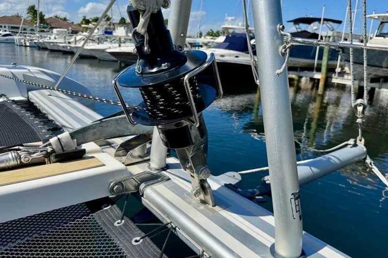Owners Version Yacht Photos Pics Close-up of a 2020 Lagoon 42 sailboat's rigging at a marina.