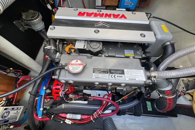 Owners Version Yacht Photos Pics Yanmar engine in a 2020 Lagoon 42 catamaran, showcasing detailed components and wiring.