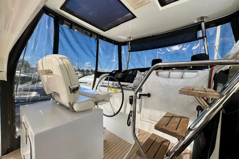 Owners Version Yacht Photos Pics Interior view of 2020 Lagoon 42 yacht helm with modern controls and seating.