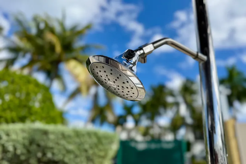 Owners Version Yacht Photos Pics Outdoor showerhead on Lagoon 42 yacht, 2020 model, with tropical background.