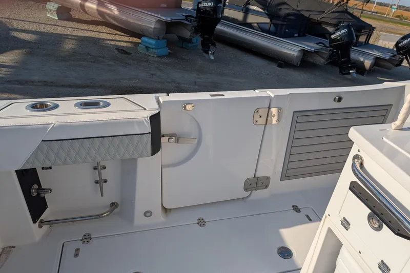  Yacht Photos Pics 2024 Blackfin 332 CC boat interior with storage compartments and seating.