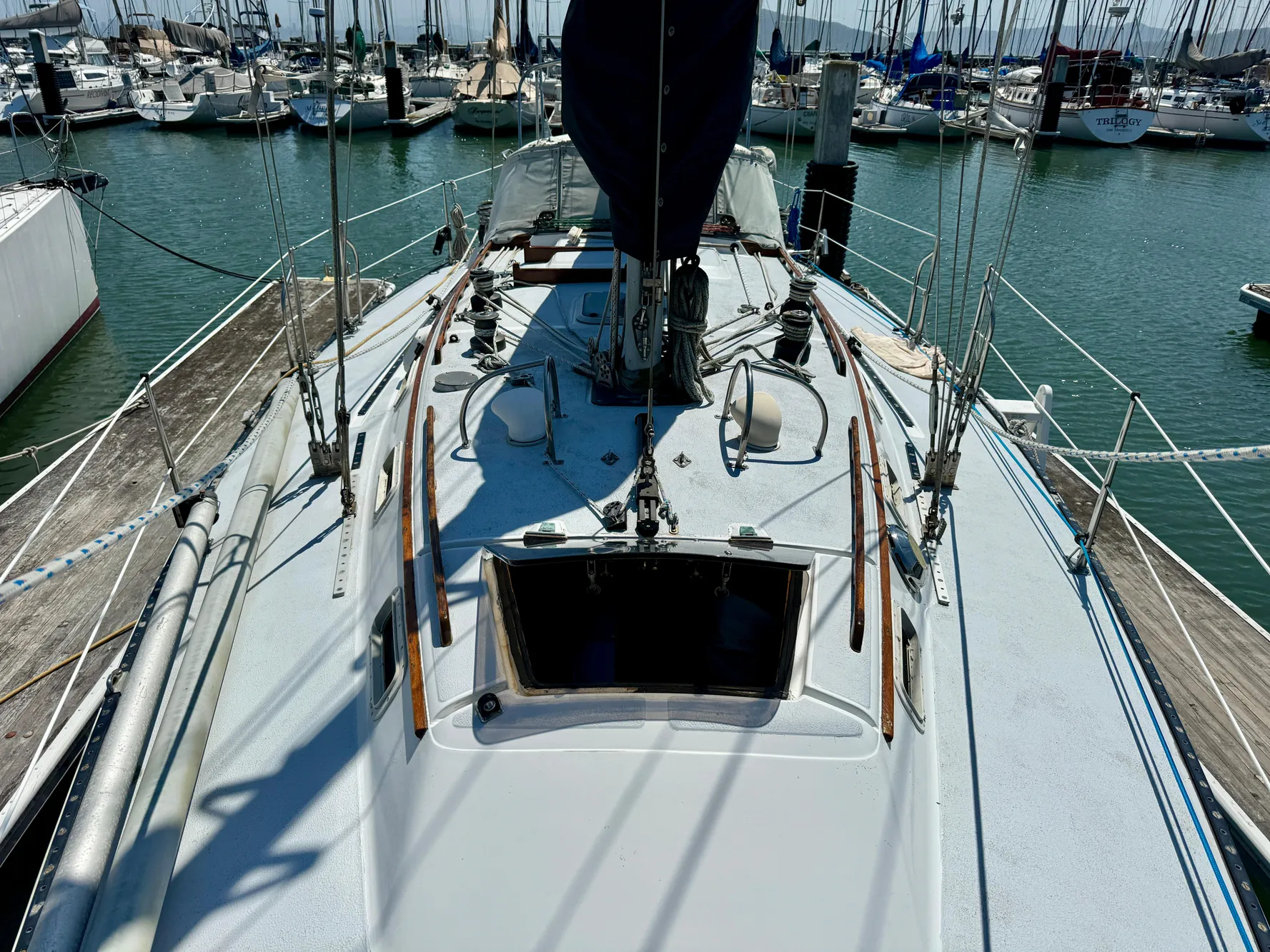 1979 Islander IP Peterson 40 sailboat docked at marina, view of deck and rigging.