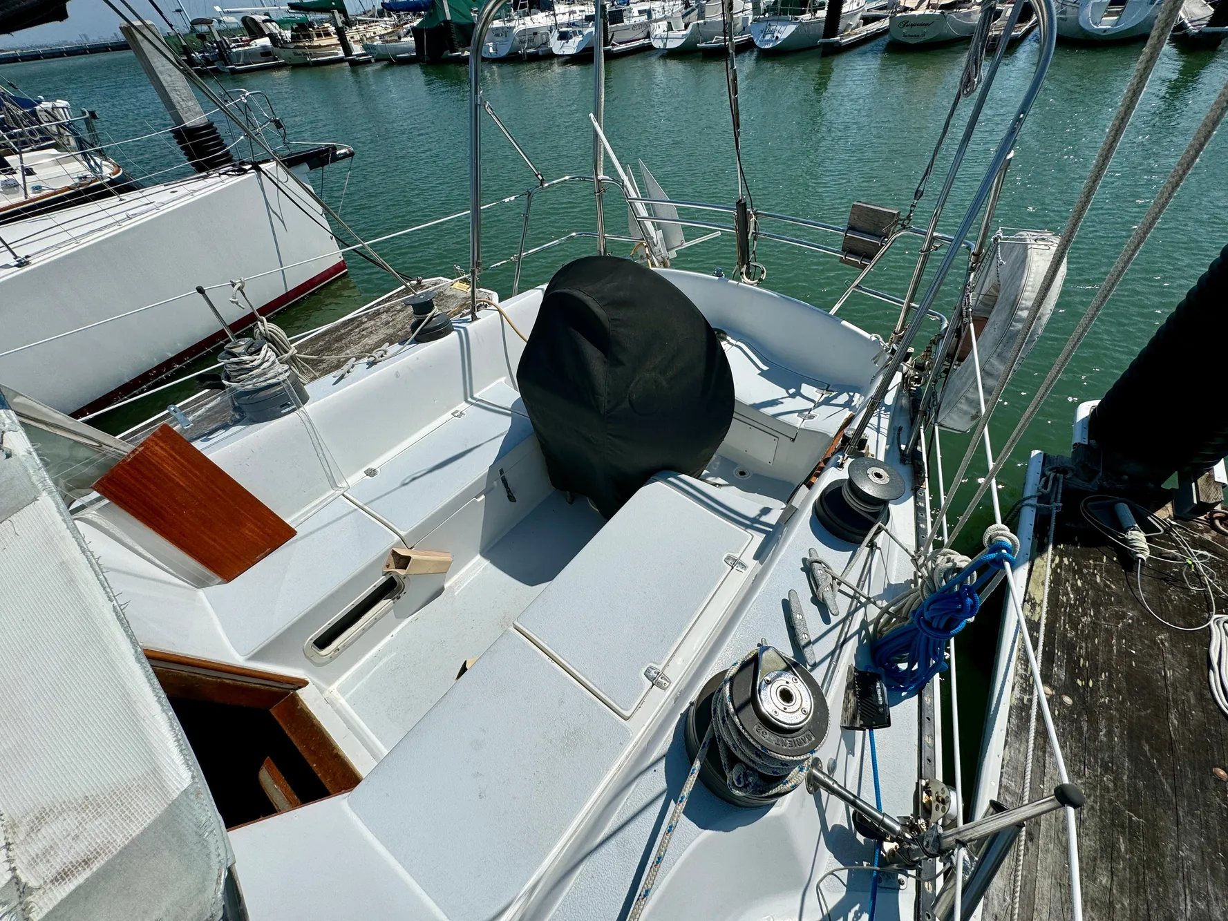 1979 Islander IP Peterson 40 sailboat docked at marina, showing cockpit and deck details.