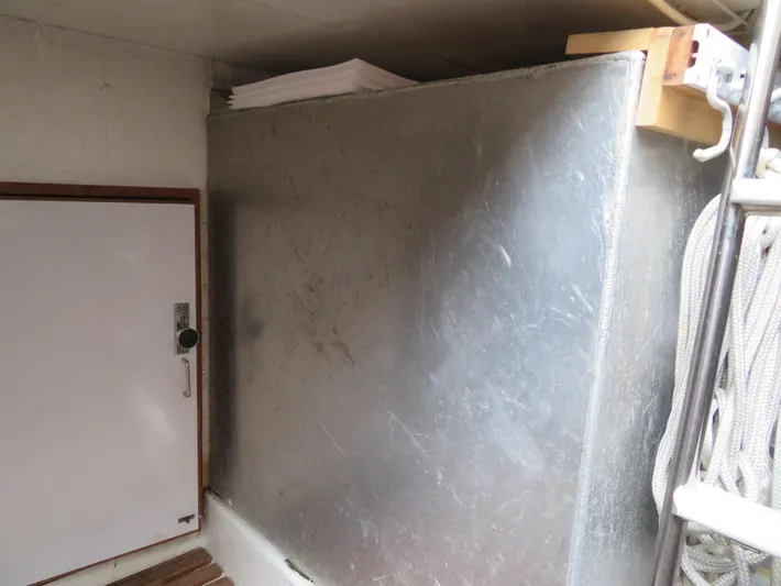 Bella Luna Yacht Photos Pics 1990 Ocean Alexander 48 Cockpit Motoryacht interior with metal panel and storage compartment.