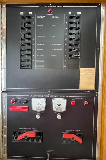  Yacht Photos Pics Electrical panel on a 1995 Hatteras 39 Sportfish boat, featuring AC distribution and switching controls.