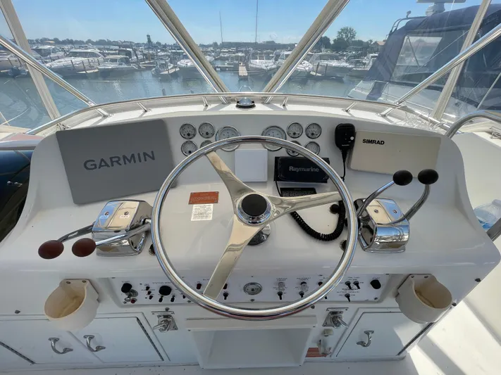  Yacht Photos Pics 1995 Hatteras 39 Sportfish helm with Garmin and Simrad navigation systems.