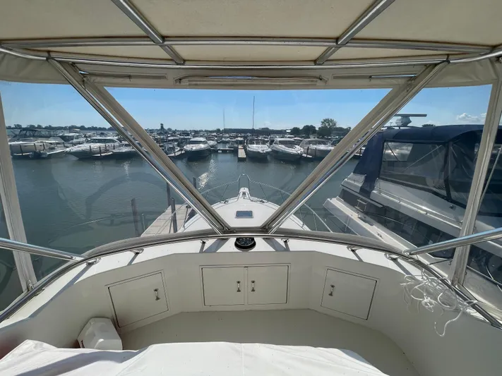 Yacht Photos Pics 1995 Hatteras 39 Sportfish yacht docked at marina, view from helm.