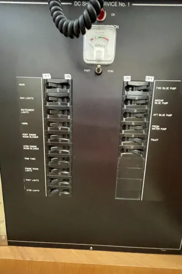  Yacht Photos Pics Electrical panel of a 1995 Hatteras 39 Sportfish boat with switches and gauges.