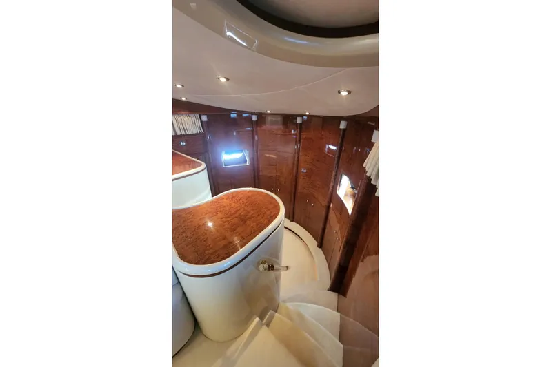  Yacht Photos Pics Luxurious interior of 2002 Horizon 105 yacht with elegant wood finishes and modern lighting.