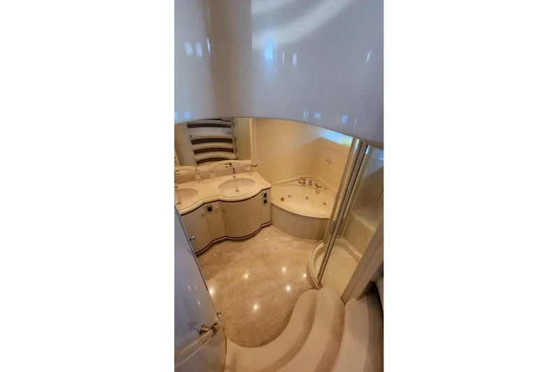  Yacht Photos Pics Luxurious bathroom in 2002 Horizon 105 yacht with dual sinks and jacuzzi tub.