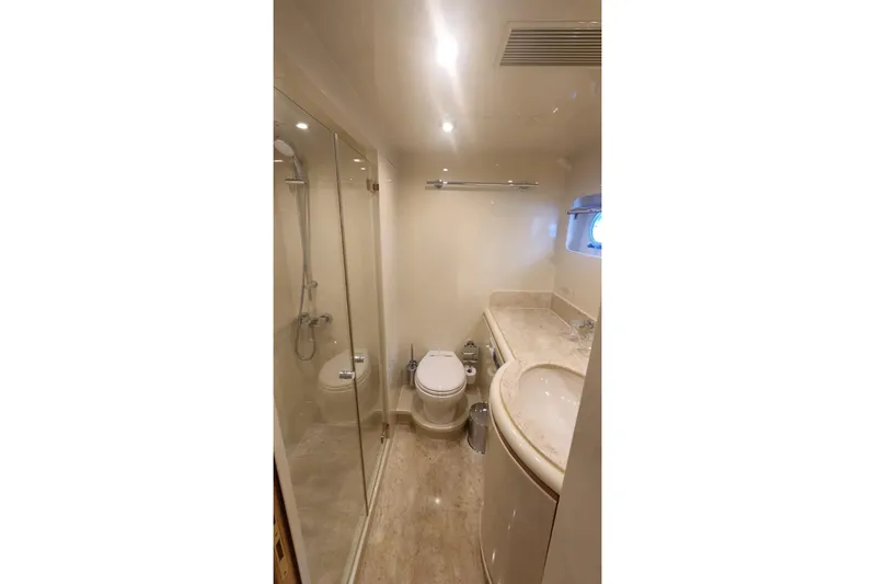  Yacht Photos Pics Luxurious yacht bathroom with shower, toilet, and sink, Horizon 105 model, 2002.