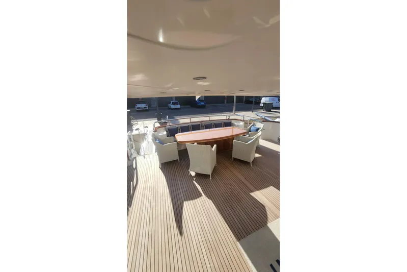  Yacht Photos Pics Spacious deck of 2002 Horizon 105 yacht with elegant seating and wooden flooring.