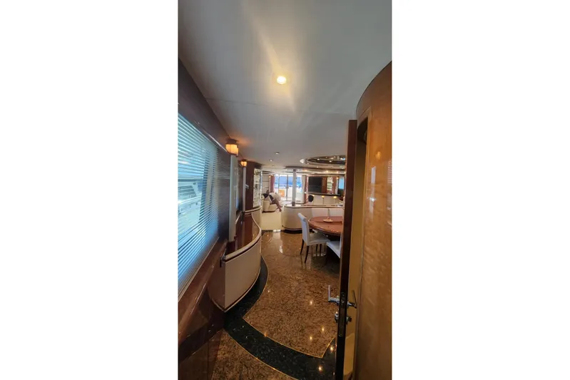  Yacht Photos Pics Luxurious interior of 2002 Horizon 105 yacht with elegant seating and polished flooring.