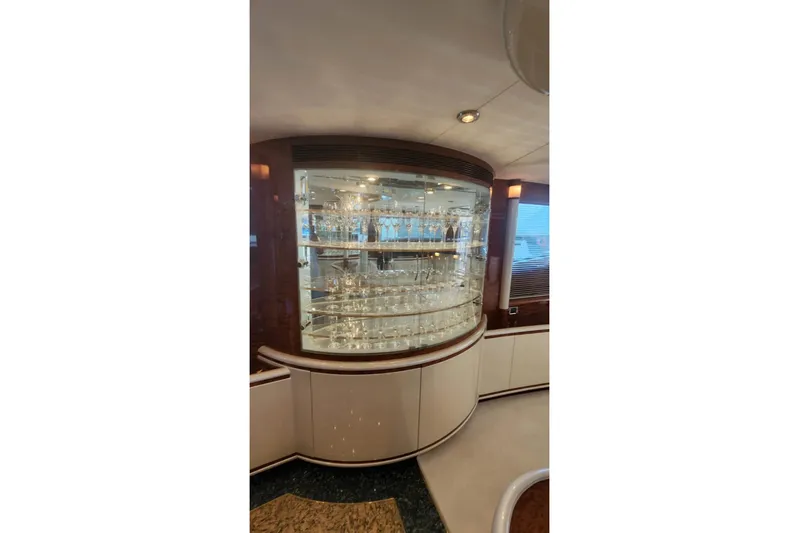  Yacht Photos Pics Luxurious glassware display on 2002 Horizon 105 yacht interior.