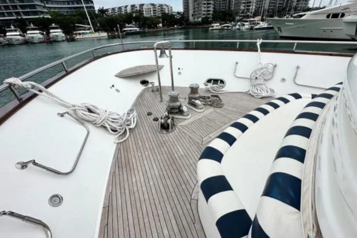  Yacht Photos Pics Deck of 2002 Horizon 105 yacht with striped seating and mooring ropes.