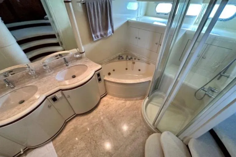  Yacht Photos Pics Luxurious bathroom in 2002 Horizon 105 yacht with double sinks, jacuzzi, and shower.