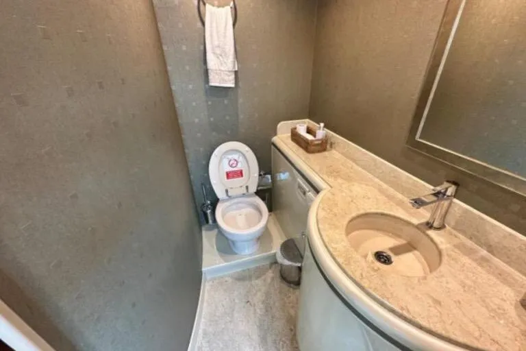  Yacht Photos Pics Small bathroom with modern fixtures in a 2002 Horizon 105 yacht.