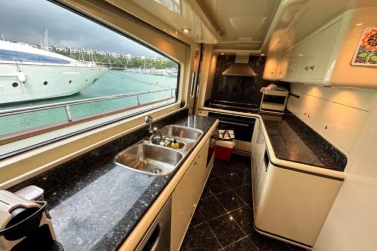  Yacht Photos Pics Luxurious kitchen interior on 2002 Horizon 105 yacht with marina view.