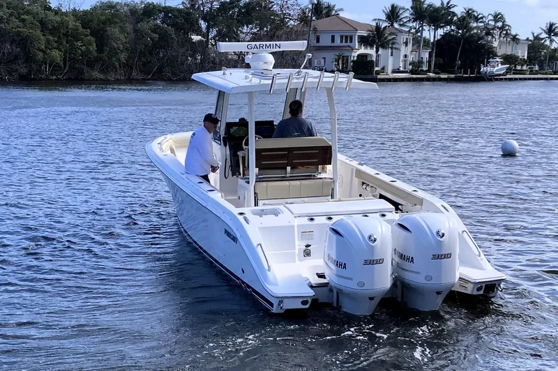 No Jet Lag Yacht Photos Pics 2019 Pursuit S 288 Sport boat with dual Yamaha engines on a calm waterway.