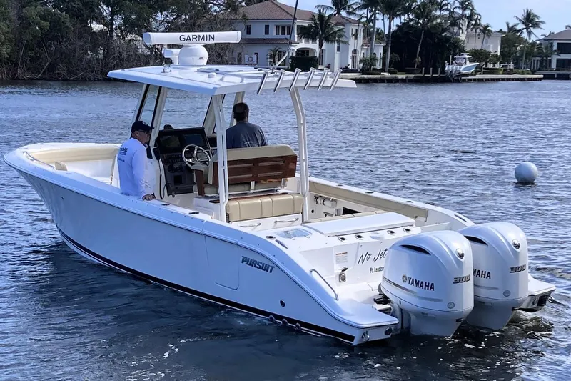 No Jet Lag Yacht Photos Pics 2019 Pursuit S 288 Sport boat with dual Yamaha engines on a calm waterway.
