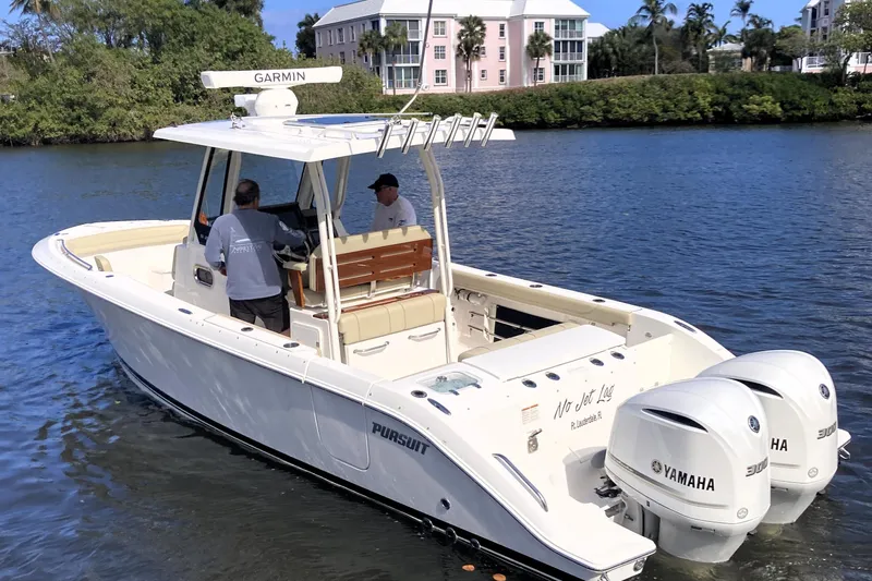 No Jet Lag Yacht Photos Pics 2019 Pursuit S 288 Sport boat with Yamaha engines on a calm waterway.