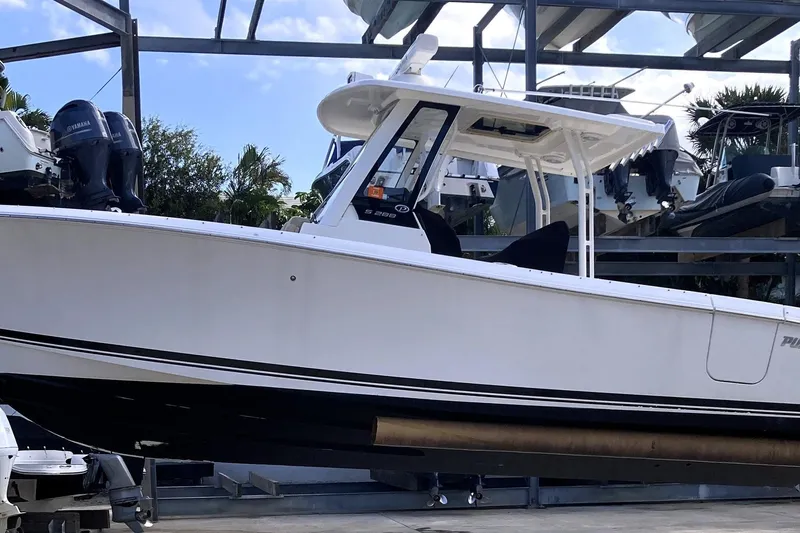 No Jet Lag Yacht Photos Pics 2019 Pursuit S 288 Sport boat on display in a marina setting.