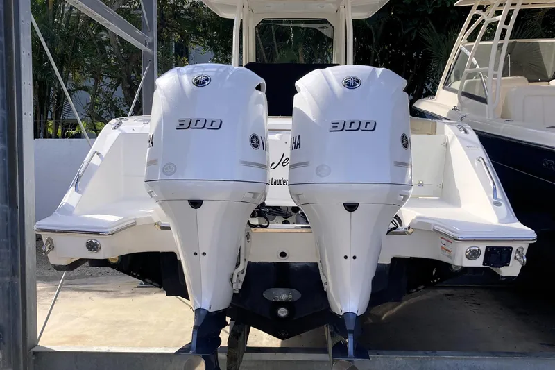 No Jet Lag Yacht Photos Pics 2019 Pursuit S 288 Sport boat with dual Yamaha 300 engines, docked.