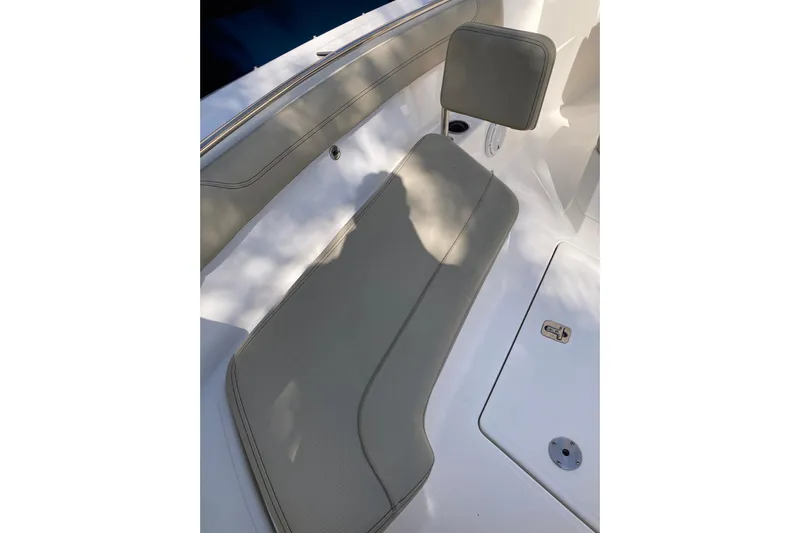 No Jet Lag Yacht Photos Pics 2019 Pursuit S 288 Sport boat seat with cushion and backrest, in sunlight.