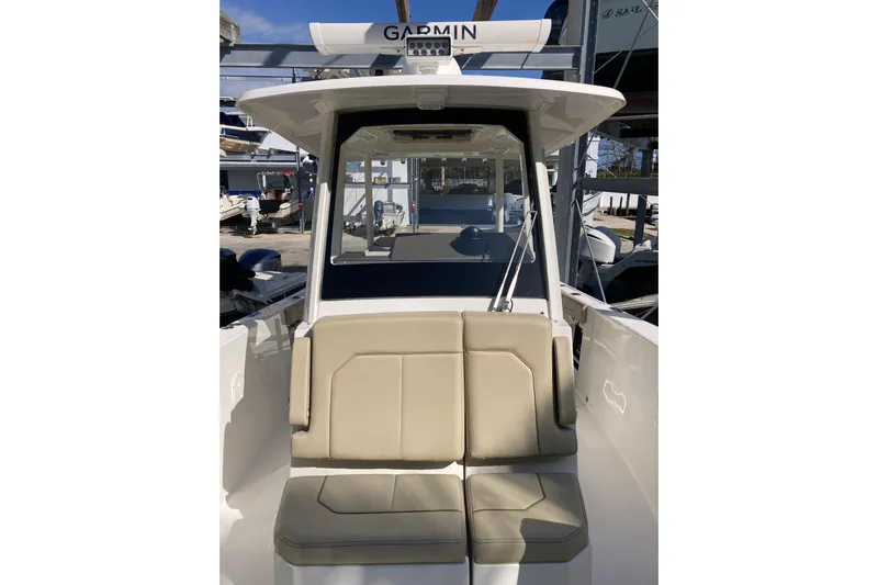 No Jet Lag Yacht Photos Pics 2019 Pursuit S 288 Sport boat with beige seating and Garmin equipment.