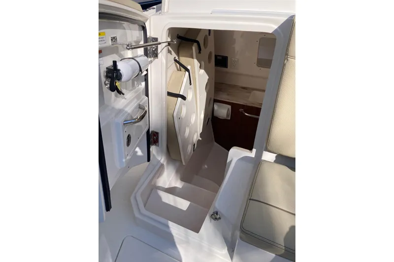 No Jet Lag Yacht Photos Pics 2019 Pursuit S 288 Sport boat interior cabin with seating and storage.