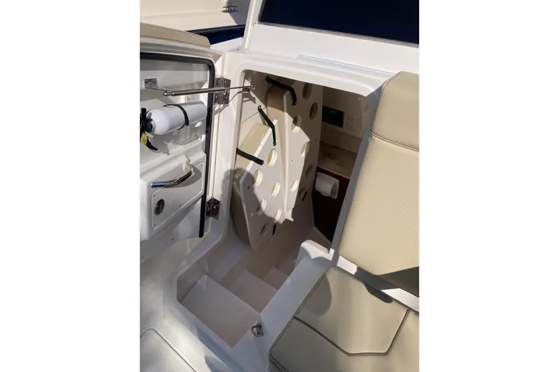 No Jet Lag Yacht Photos Pics 2019 Pursuit S 288 Sport boat interior with seating and storage compartment.