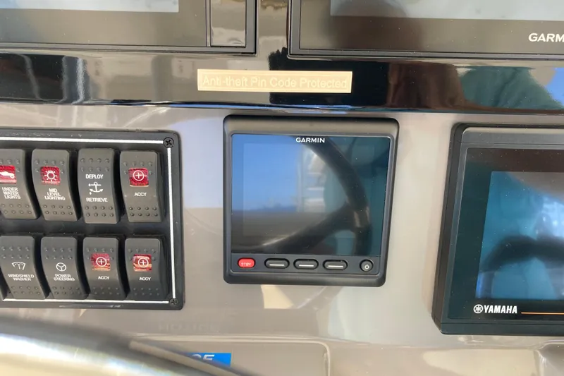 No Jet Lag Yacht Photos Pics Control panel of 2019 Pursuit S 288 Sport boat with Garmin and Yamaha displays.
