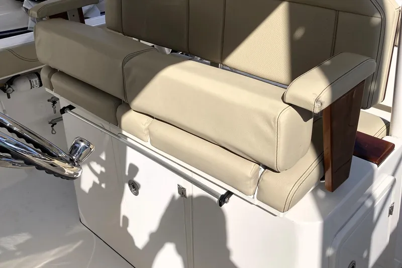 No Jet Lag Yacht Photos Pics 2019 Pursuit S 288 Sport boat interior with beige seating and chrome details.