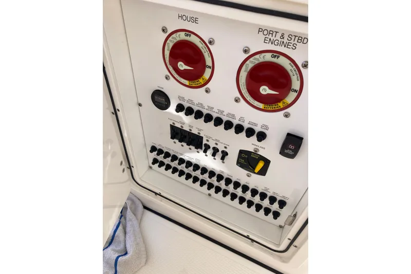 No Jet Lag Yacht Photos Pics Control panel of 2019 Pursuit S 288 Sport boat with switches and dials.