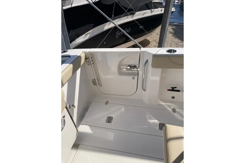 No Jet Lag Yacht Photos Pics 2019 Pursuit S 288 Sport boat interior with seating and storage compartments.