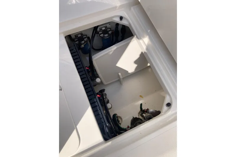 No Jet Lag Yacht Photos Pics 2019 Pursuit S 288 Sport boat storage compartment with visible wiring and components.