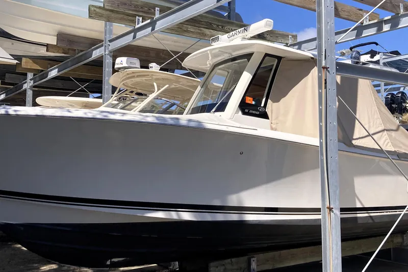 No Jet Lag Yacht Photos Pics 2019 Pursuit S 288 Sport boat in storage, featuring Garmin equipment.