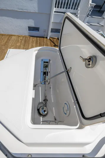 Jokers Jewel Yacht Photos Pics Open storage compartment on 2019 Wellcraft 352 Fisherman boat, showcasing interior details.