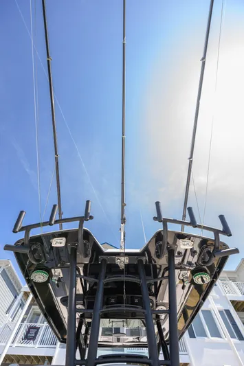 Jokers Jewel Yacht Photos Pics 2019 Wellcraft 352 Fisherman boat, view of fishing rods and equipment against a clear blue sky.