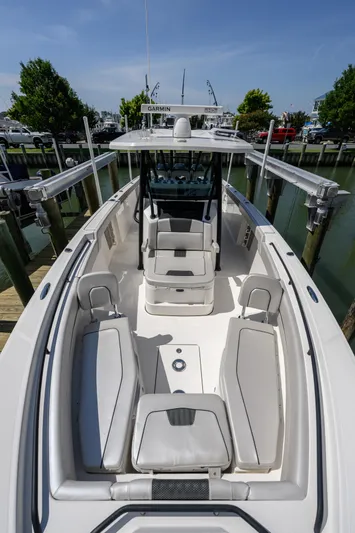 Jokers Jewel Yacht Photos Pics 2019 Wellcraft 352 Fisherman boat with spacious seating and modern design at a dock.