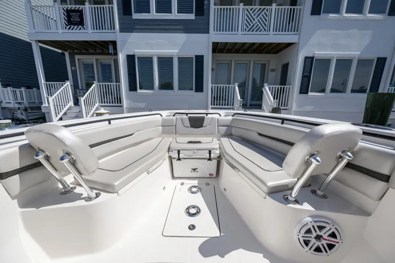 Jokers Jewel Yacht Photos Pics 2019 Wellcraft 352 Fisherman boat interior with seating, near waterfront homes.