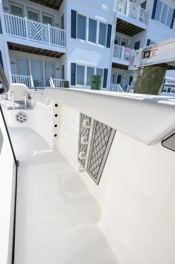 Jokers Jewel Yacht Photos Pics 2019 Wellcraft 352 Fisherman boat interior with modern design near waterfront buildings.