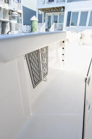 Jokers Jewel Yacht Photos Pics 2019 Wellcraft 352 Fisherman boat interior with clean white deck and storage compartments.