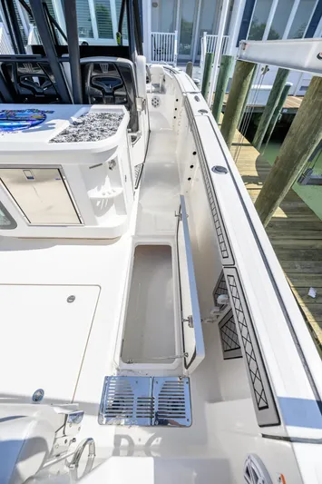 Jokers Jewel Yacht Photos Pics 2019 Wellcraft 352 Fisherman boat deck with open storage compartment and seating area.