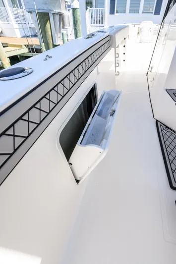 Jokers Jewel Yacht Photos Pics 2019 Wellcraft 352 Fisherman boat interior with storage compartment open.