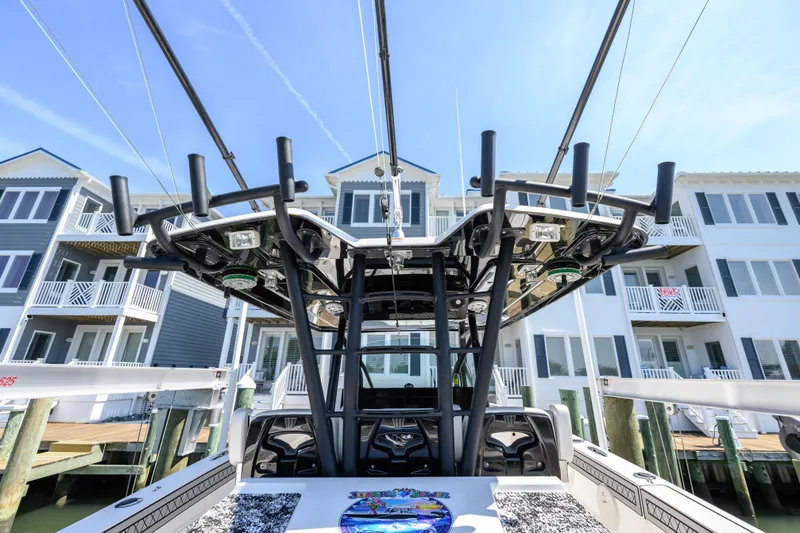 Jokers Jewel Yacht Photos Pics 2019 Wellcraft 352 Fisherman boat docked near waterfront homes.